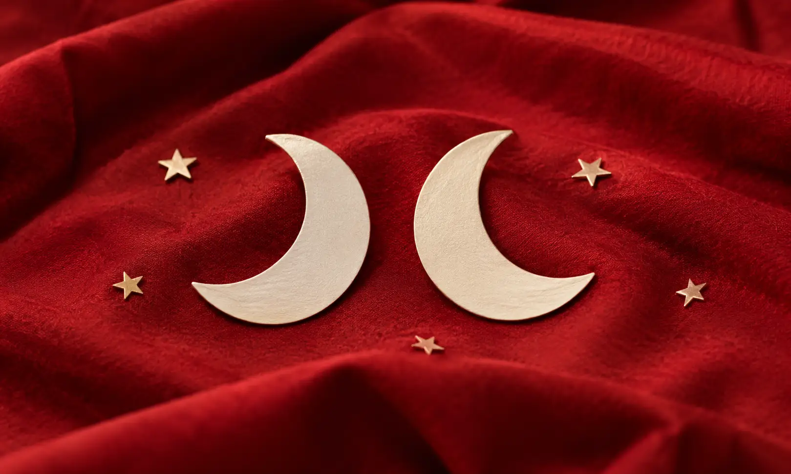 Moon sign compatibility for love — two paper crescent moons side by side